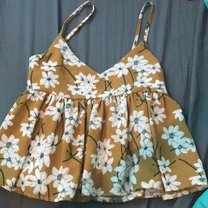 Orange/yellow top with white flowers